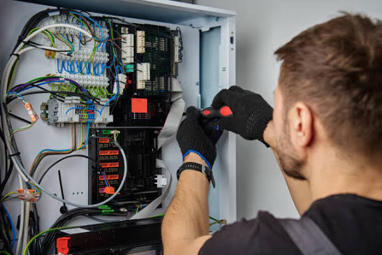 An electric furnace air handler cabinet with its access panel removed